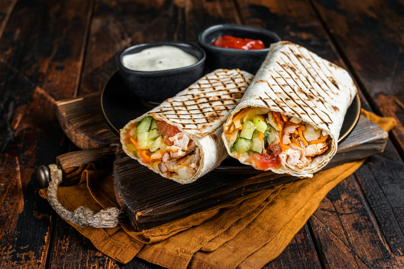 Shawarma, Shaurma chicken roll with vegetable salad. Wooden background. Top view